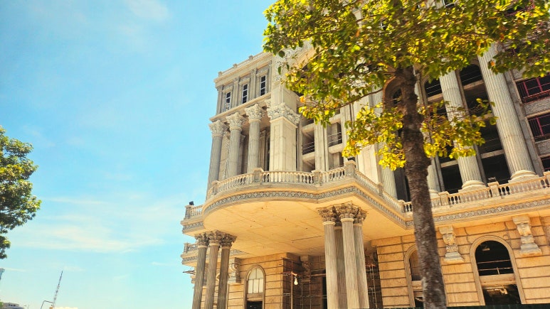 A grand European-style building seen from the van on the way to Mui Ne.